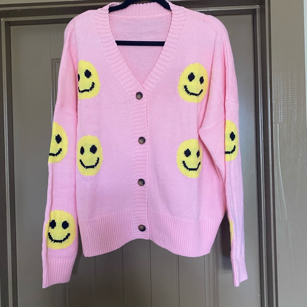 Pink smile sweater.